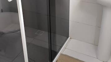 Basic Suite | Bathroom | Shower, towels, soap, toilet paper
