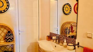 Separate bathtub and shower, hair dryer, towels, toilet paper