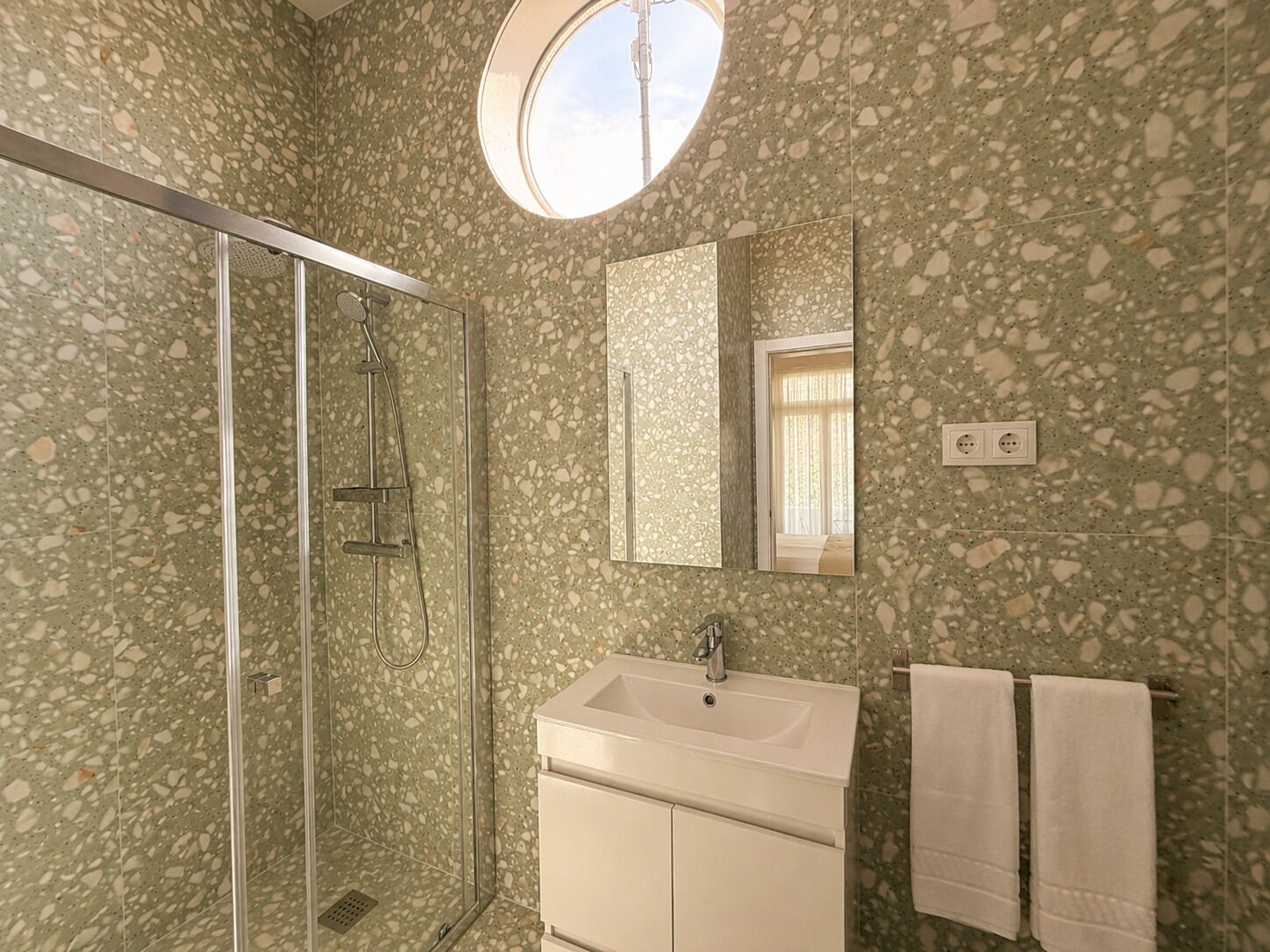 Shower, hair dryer, towels, toilet paper