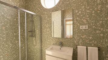 Shower, hair dryer, towels, toilet paper
