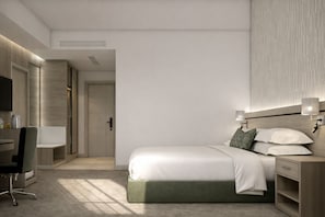 A modern hotel room with a bed, bedside tables, a desk, and a chair.