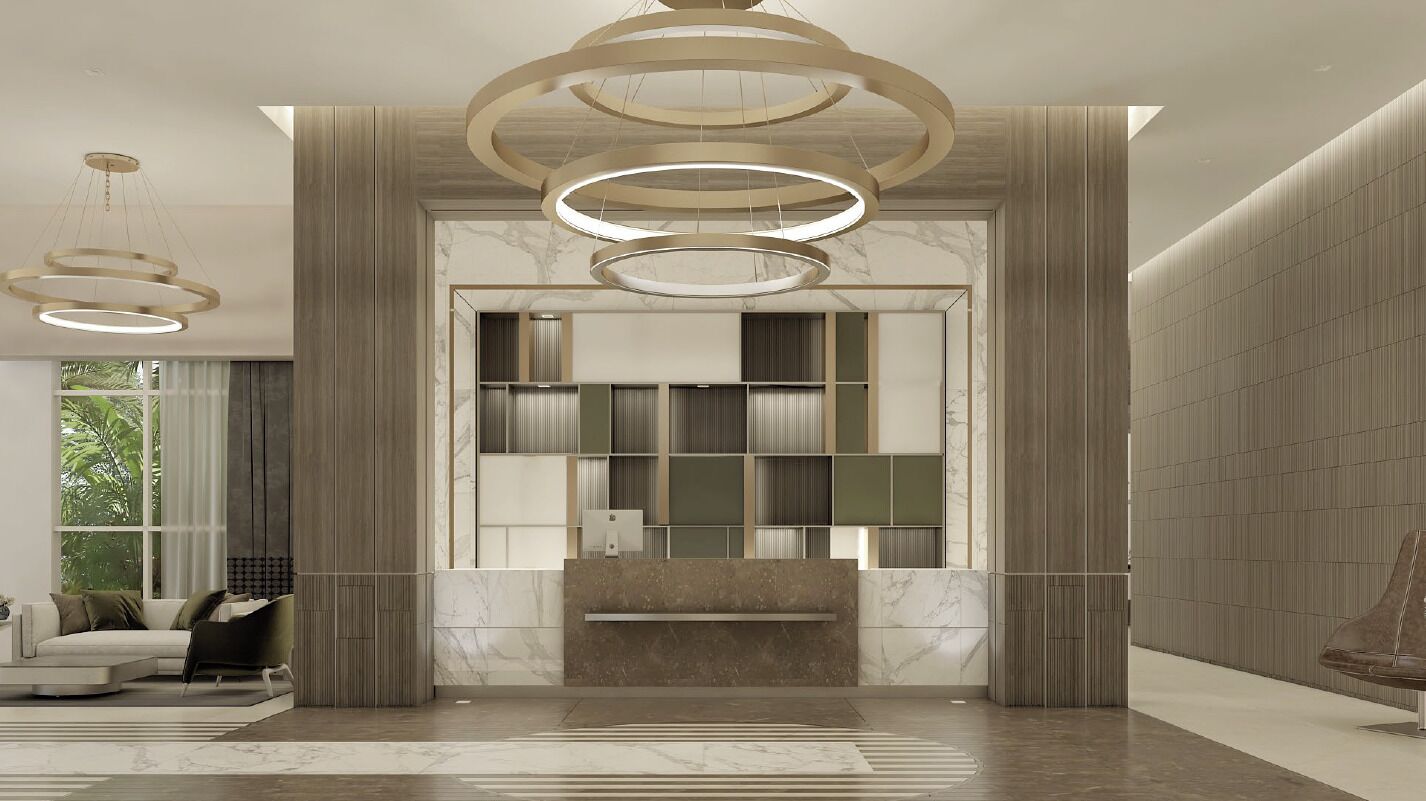 Un hall d’entrée moderne comprenant un comptoir de réception, un espace détente avec un canapé et des fauteuils, et une grande fenêtre offrant une vue sur la verdure environnante.