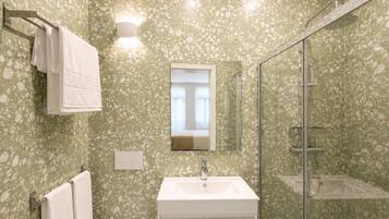 Shower, hair dryer, towels, toilet paper