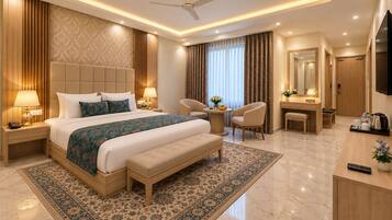 A modern hotel room with a large bed, a desk, a chair, a television, and a bathroom.