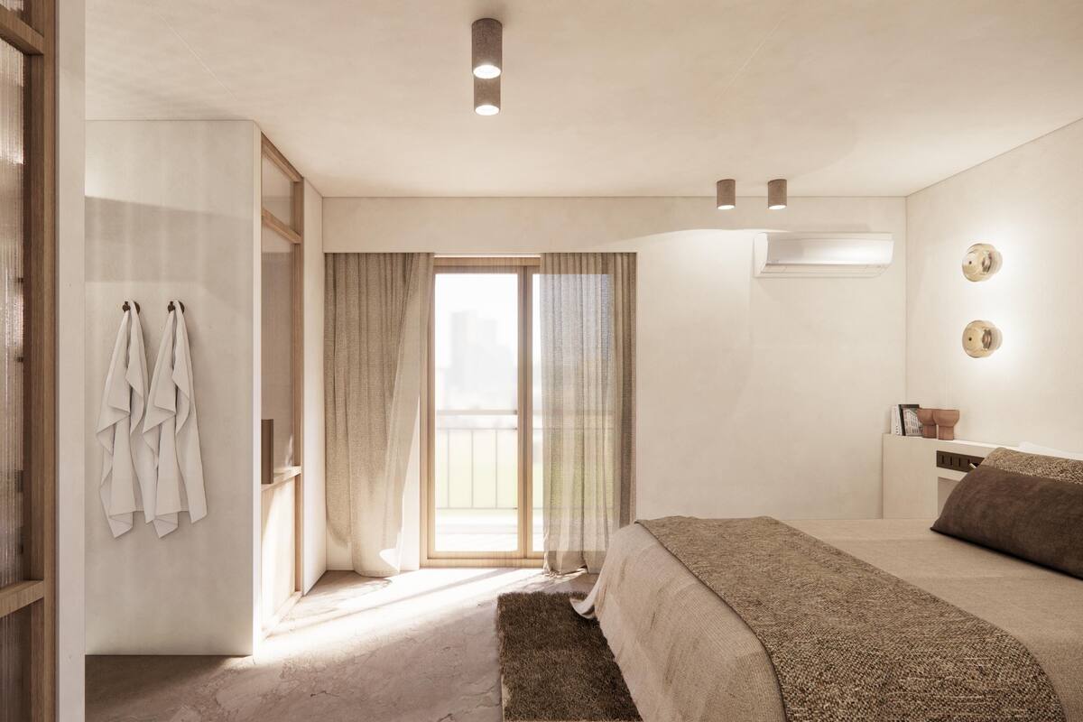 Un dormitorio con cama, armario, espejo y ventana.