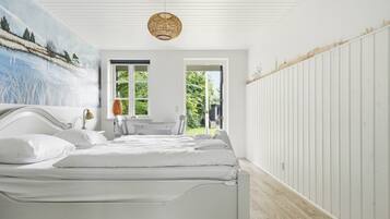 Desk, laptop workspace, bed sheets