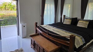 A bedroom with a bed, curtains, a bench, and a view of greenery outside. - My Paradise Private Resort Chiang Rai (Chiang Rai)