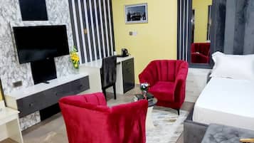 Deluxe Apartment, Balcony, City View | Desk, laptop workspace, blackout drapes, soundproofing
