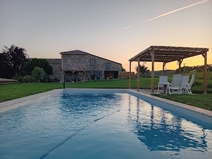 A swimming pool with a stone house in the background. - Country house, ideally located in the Tarn! (Tonnac)