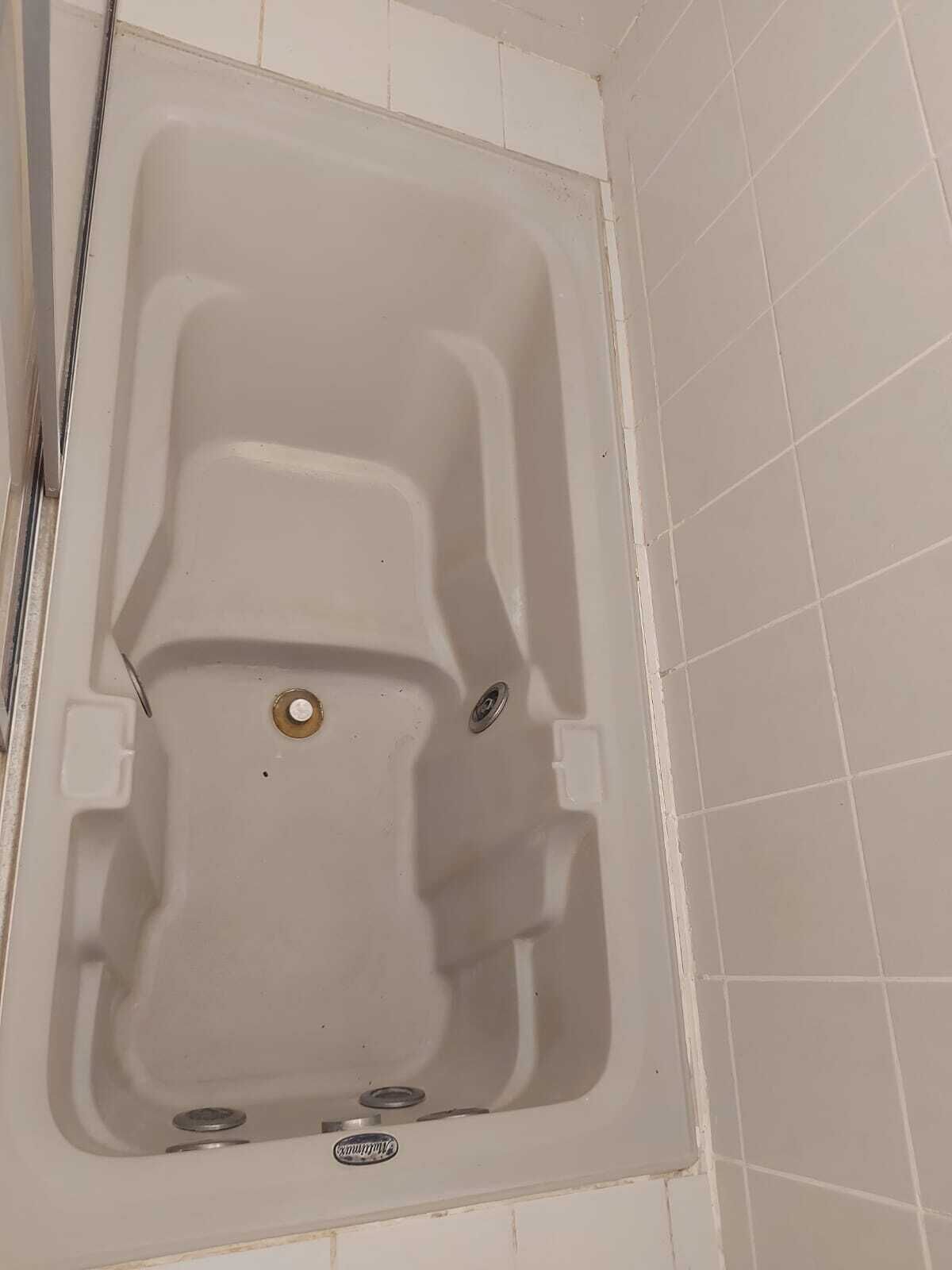 Shower, jetted tub, soap, toilet paper