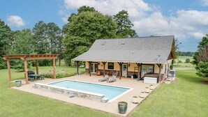 A house with a swimming pool, outdoor seating, and a covered patio. - Last Chance Ranch - Hallsville TX (Hallsville)