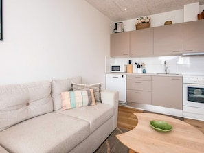 A modern kitchen with a built-in oven, microwave, and dishwasher. - 4 Star Holiday Home in Fano (Fano)