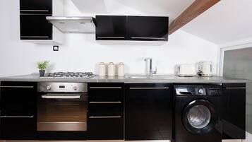 Apartment | Private kitchen | Fridge, stovetop, cookware/dishes/utensils