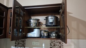 A kitchen with a built-in microwave, a rice cooker, and a blender on a shelf. - Kamaleswari Villa Trincomalee | 3BR House | 2km to Beach | Family Stay (Trincomalee)