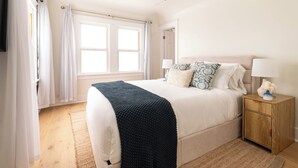 A bedroom with a bed, bedside tables, a ceiling fan, - NEW! Boutique Coastal home Steps from the Beach (Marina del Rey)