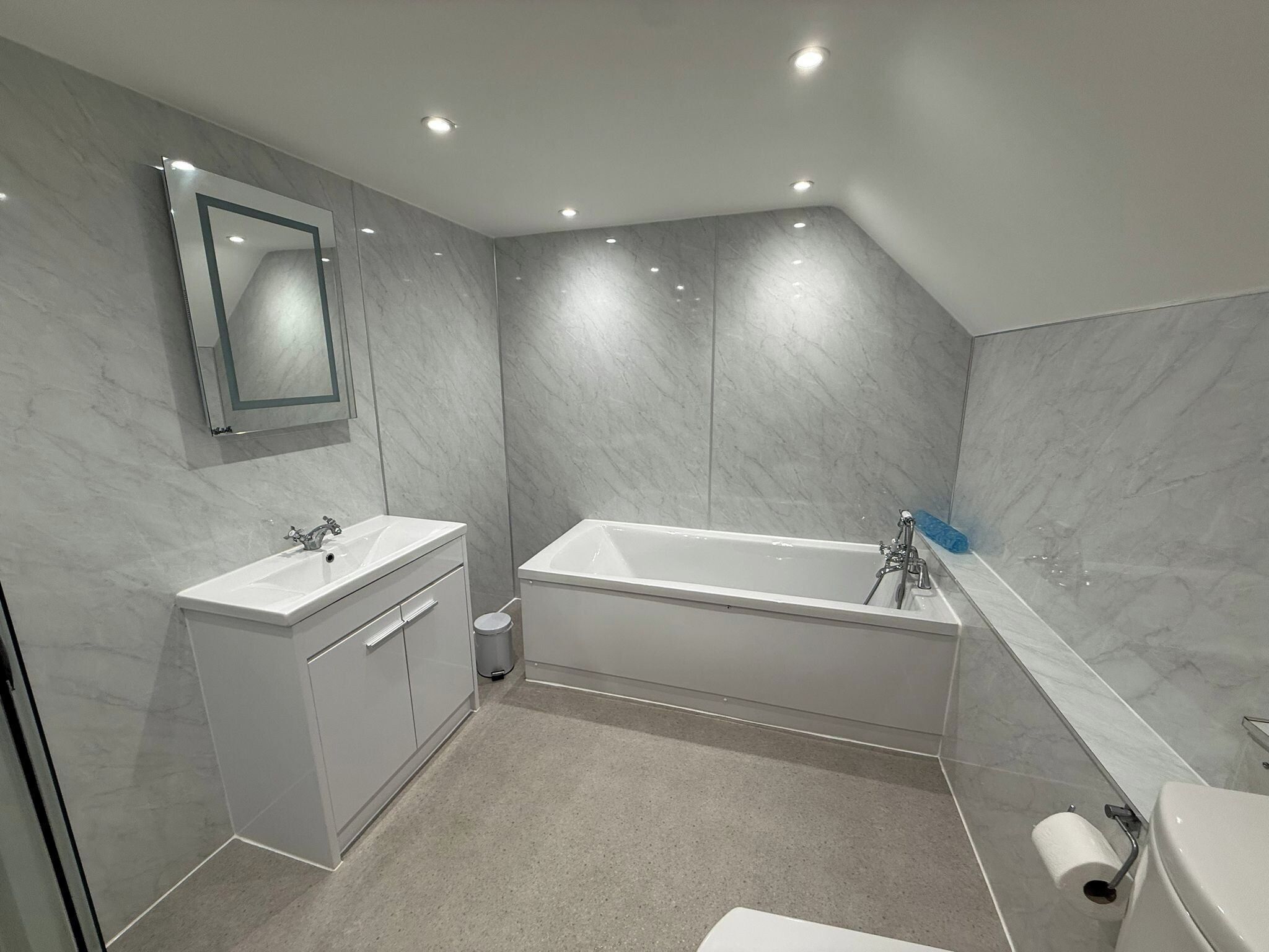 Separate tub and shower, deep soaking tub, hair dryer, towels