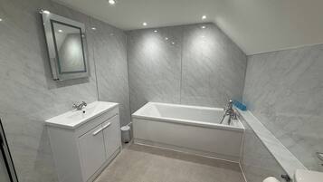 Separate tub and shower, deep soaking tub, hair dryer, towels