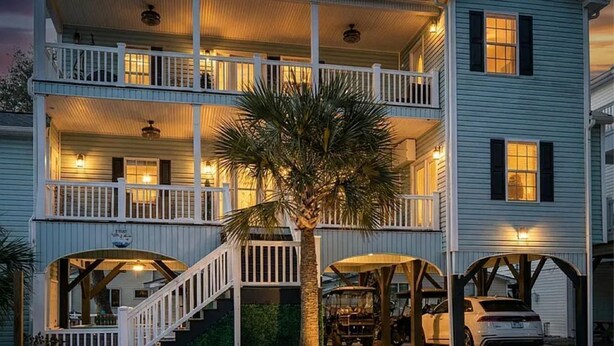 A two-story house with a balcony, a staircase, and a garage. - Ocean Views, 5 min walk to Beach, Waterpark, Arcade, Store ~ 5 bd/3; Sleeps 10 (Myrtle Beach)