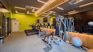 A gym with treadmills, weight machines, and exercise balls. - Harmonia da Vila (São Paulo)