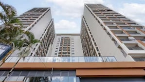 A high-rise building with a modern architectural design, featuring multiple balconies and a glass facade. - Zip Brooklin (São Paulo)