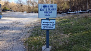 A parking sign for a boat and trailer area. - H Lakefront Property, Remodeled, Boat Slip, Patio Views, Pool, Ideal Location! (Osage Beach)