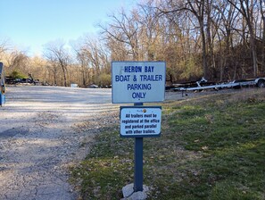 A parking sign for a boat and trailer area. - H Lakefront Property, Remodeled, Boat Slip, Patio Views, Pool, Ideal Location! (Osage Beach)