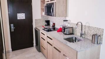 Coffee/tea maker, microwave, cookware/dishes/utensils