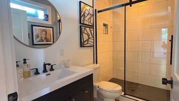 Shower, towels, soap, toilet paper