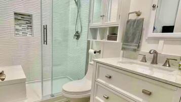 Shower, hair dryer, towels, soap