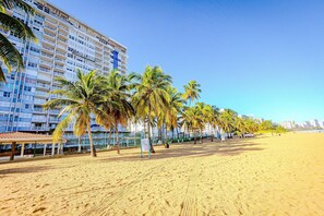 Step straight from your building onto the golden sands of Isla Verde Beach and start your tropical getaway the moment you arrive. - 1BR Beachfront Apt with King Bed Isla Verde (Avenida Isla)