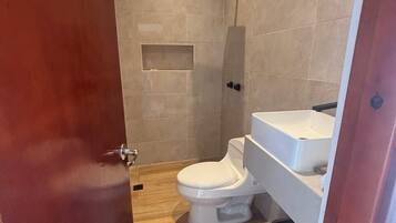 Shower, towels, soap, toilet paper