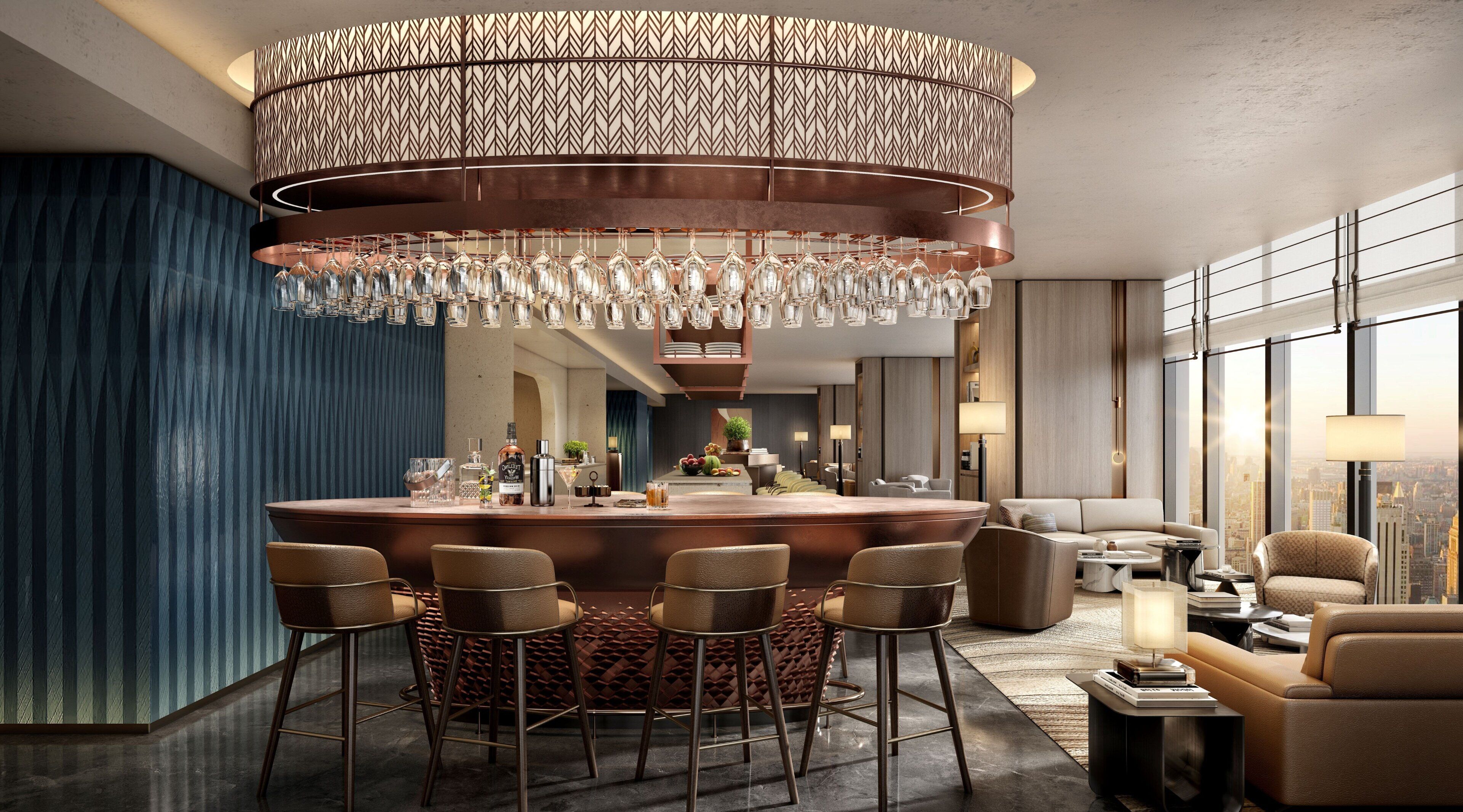 A modern bar area with a central island, bar stools, and a patterned ceiling light fixture.
