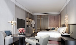A modern hotel room with a bed, seating area, TV, and a minibar. - Intercontinental Taipei by IHG (Taipei)