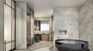A modern bathroom with a large bathtub, a mirror, and a sink. - Intercontinental Taipei by IHG (Taipei)