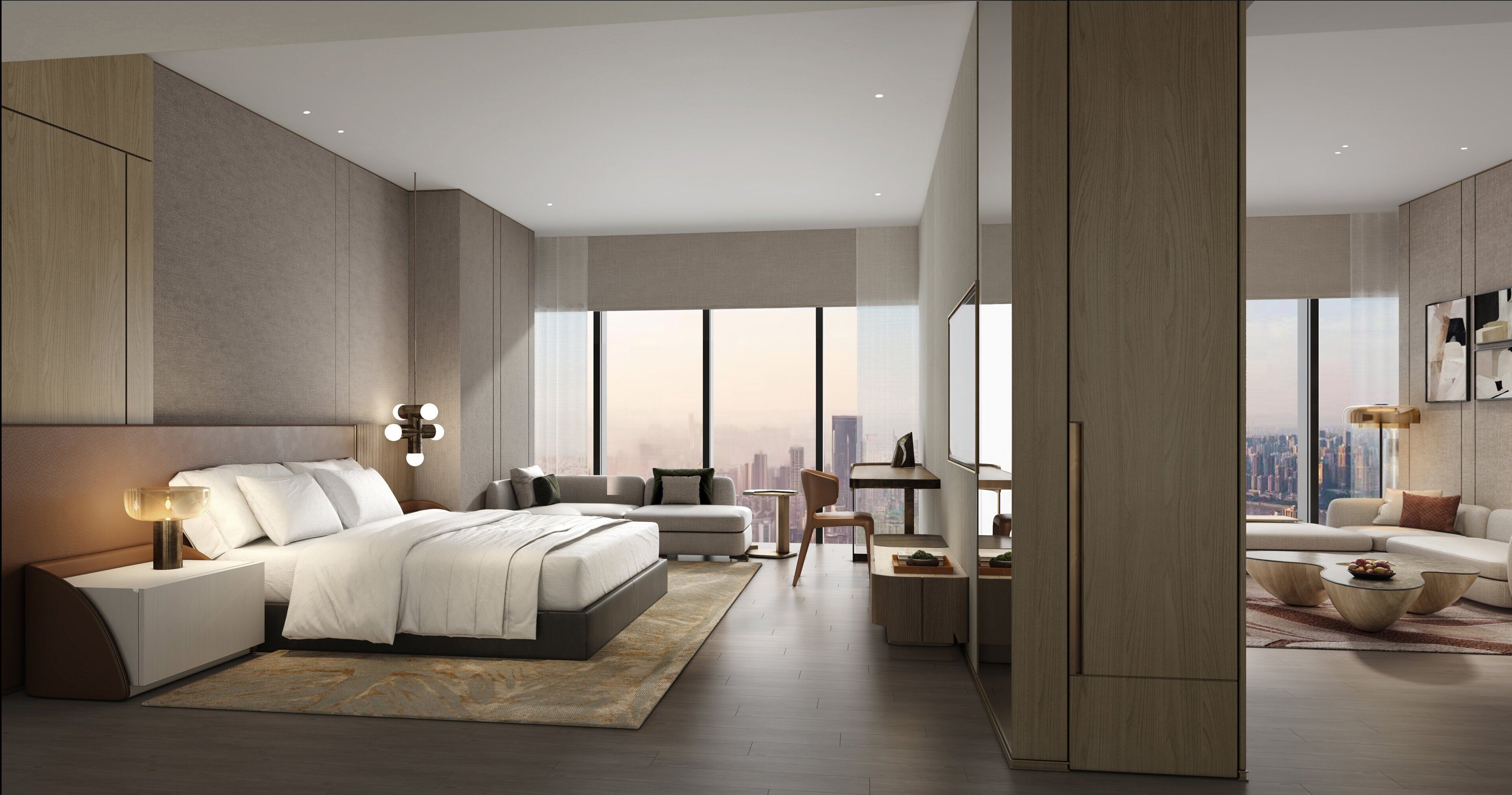 A modern bedroom with a large bed, a desk, and a view of the city.