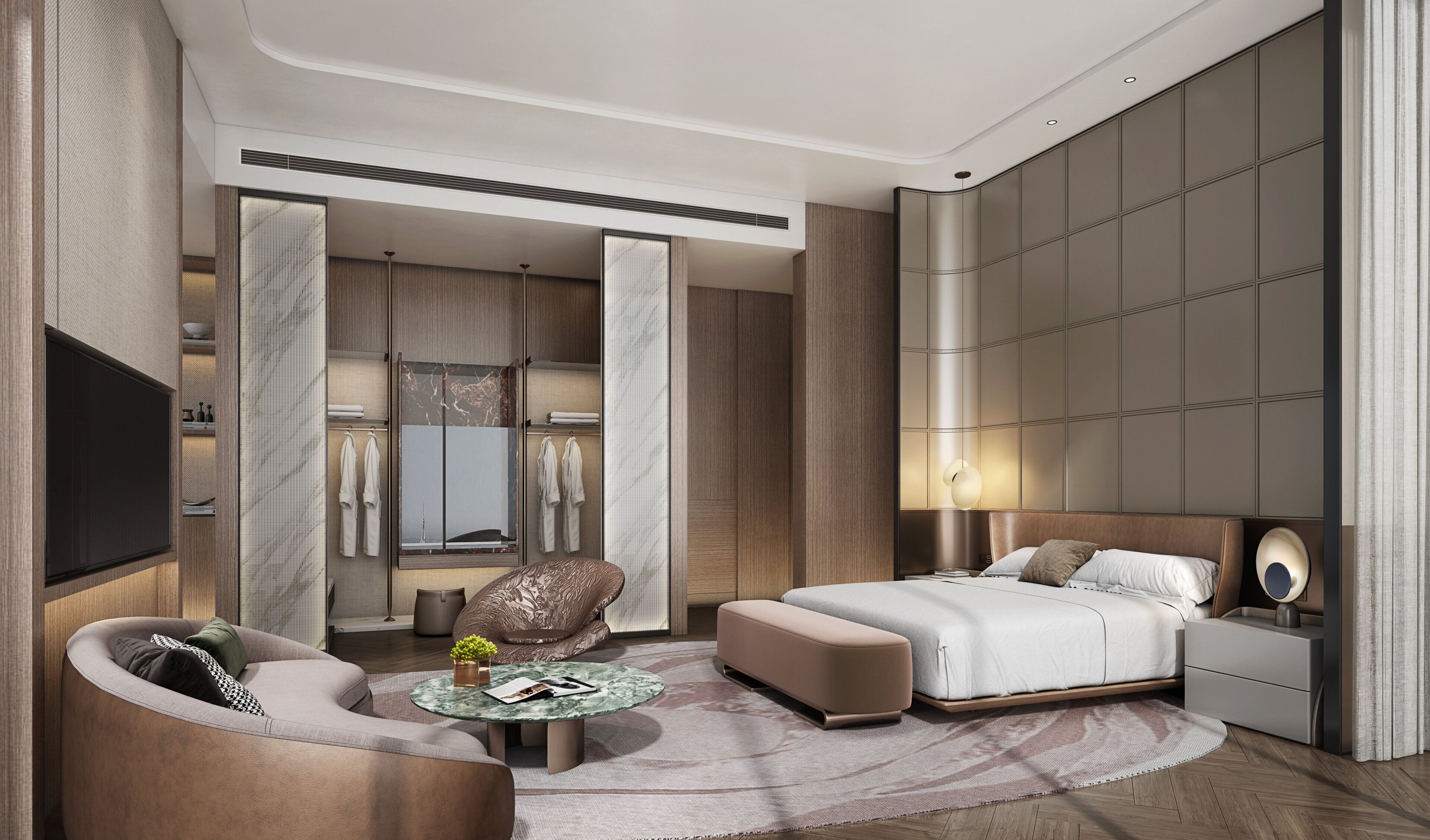 Quarto de hotel moderno com cama, área de estar, televisão e guarda-roupa.
