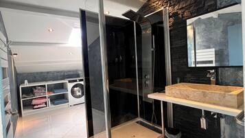 Shower, hair dryer, towels, toilet paper