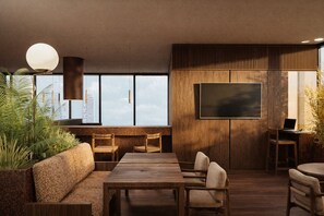 A modern interior with a sofa, dining table, chairs, a TV, and a laptop on a desk. - Intercontinental Presidente Mexico City Miyana by IHG (Mexico City)