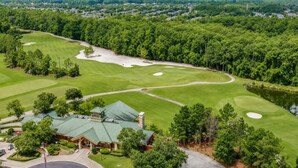 A golf course with a clubhouse, a roundabout, and a lake. - The King & Bear Luxury Studio Retreat (St. Augustine)