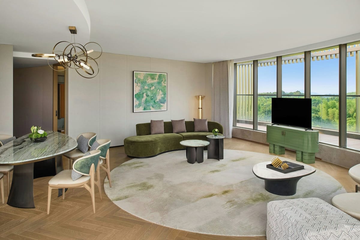 Suite, 2 Bedrooms, Terrace | Living room | 55-inch TV with satellite channels, ping pong, books