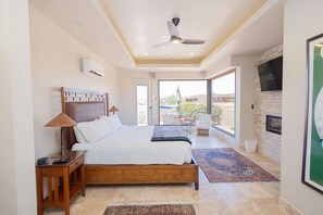 A bedroom with a bed, bedside table, lamp, and a ceiling fan. - Desert Retreat w/ Red Rock Views & Private Casita (St. George)