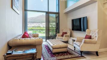 Presidential Apartment, 2 Bedrooms, Kitchen, Mountain View | Living area | 55-inch Smart TV with satellite channels, Netflix, streaming services