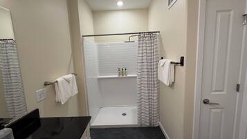 Shower, towels, soap, toilet paper