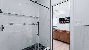 Shower, hair dryer, towels, soap