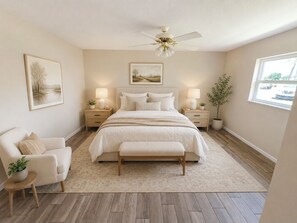 A bedroom with a bed, bedside tables, a chair, a bench, a ceiling fan, and a window. - Charming 2-bedroom townhome in Punta Gorda perfect for relaxing stay (Punta Gorda)