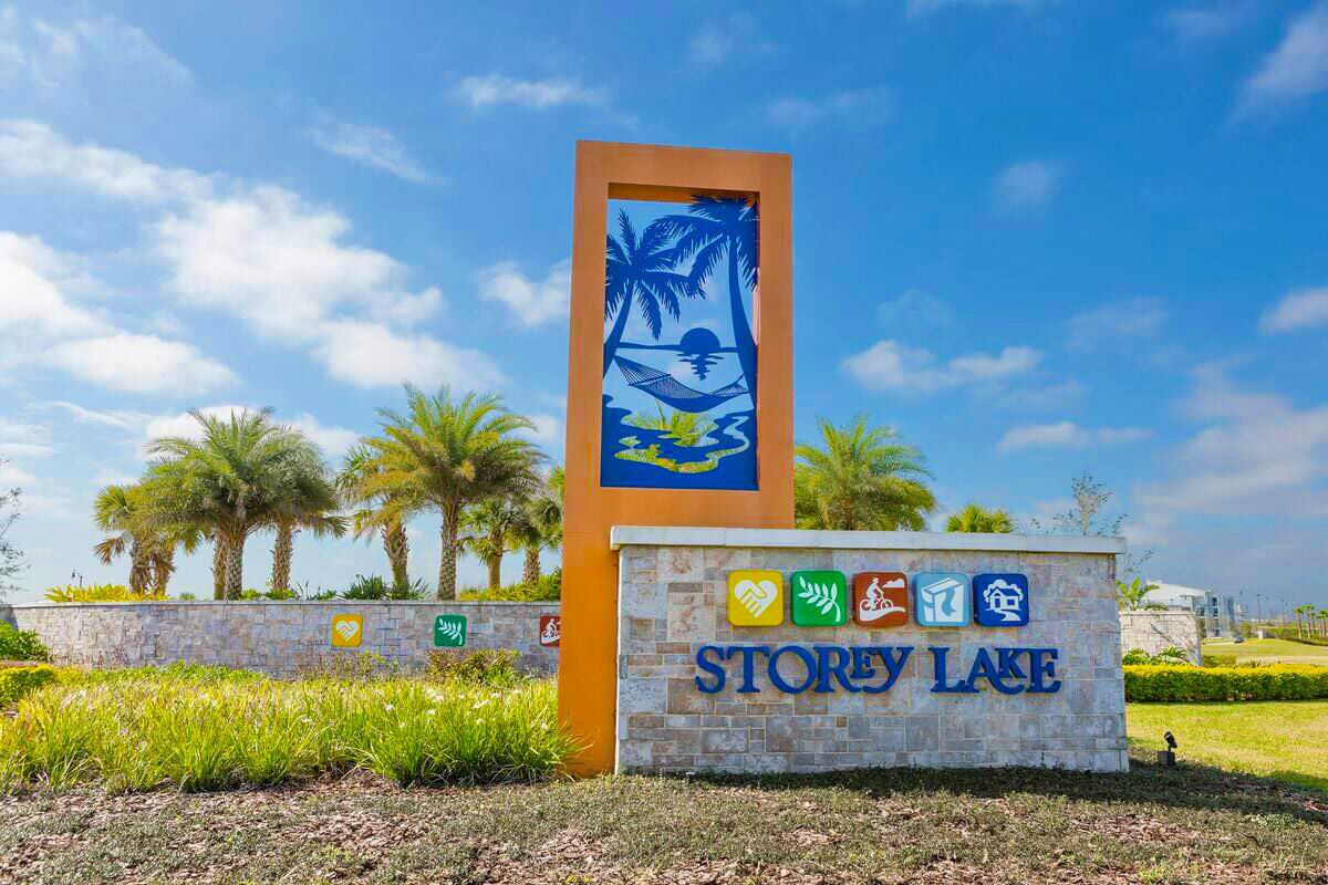 A sign for Storey Lake with palm trees and a hammock illustration.