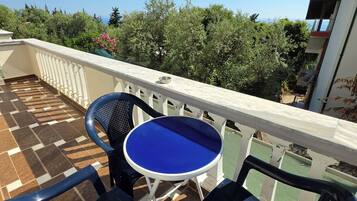 Family Apartment, Balcony, Sea View | Outdoor dining
