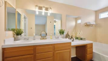 Shower, hair dryer, towels, shampoo