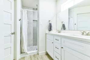 Shower, hair dryer, towels, soap