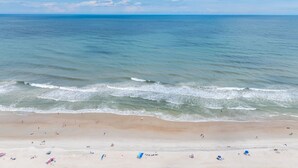 A beach with clear skies and calm waters. - Waterfront Paradise, 5BR, Elevator, Expansive Decks & Views (Surf City)